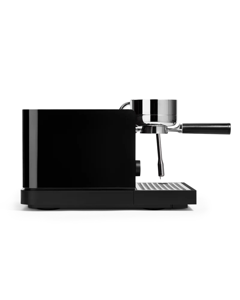 Fellow Espresso Series 1 Espresso Machine side view with portafilter attached, showcasing sleek design and precision.