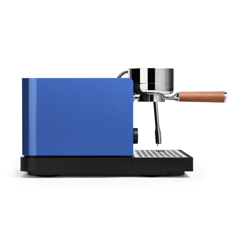 Marine Blue Fellow Espresso Series 1 Espresso Machine side view with portafilter attached, showcasing sleek design and precision.